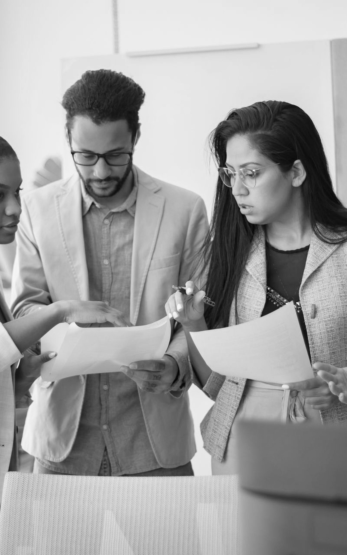 Business professionals reviewing documents together